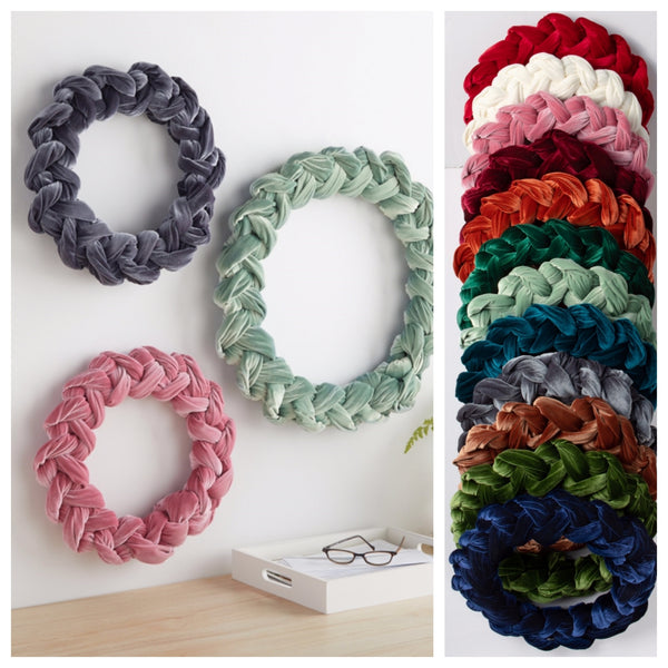 Handmade velvet wreaths shown in 12 colors and 2 sizes.  The left side of the image shows the gray, blush and sage wreaths on a wall.  The right side shows the 12 colors available.
