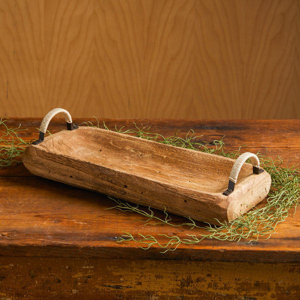Photo of rectangular wood tray with two handles. Artificial Spanish moss is around the tray.
